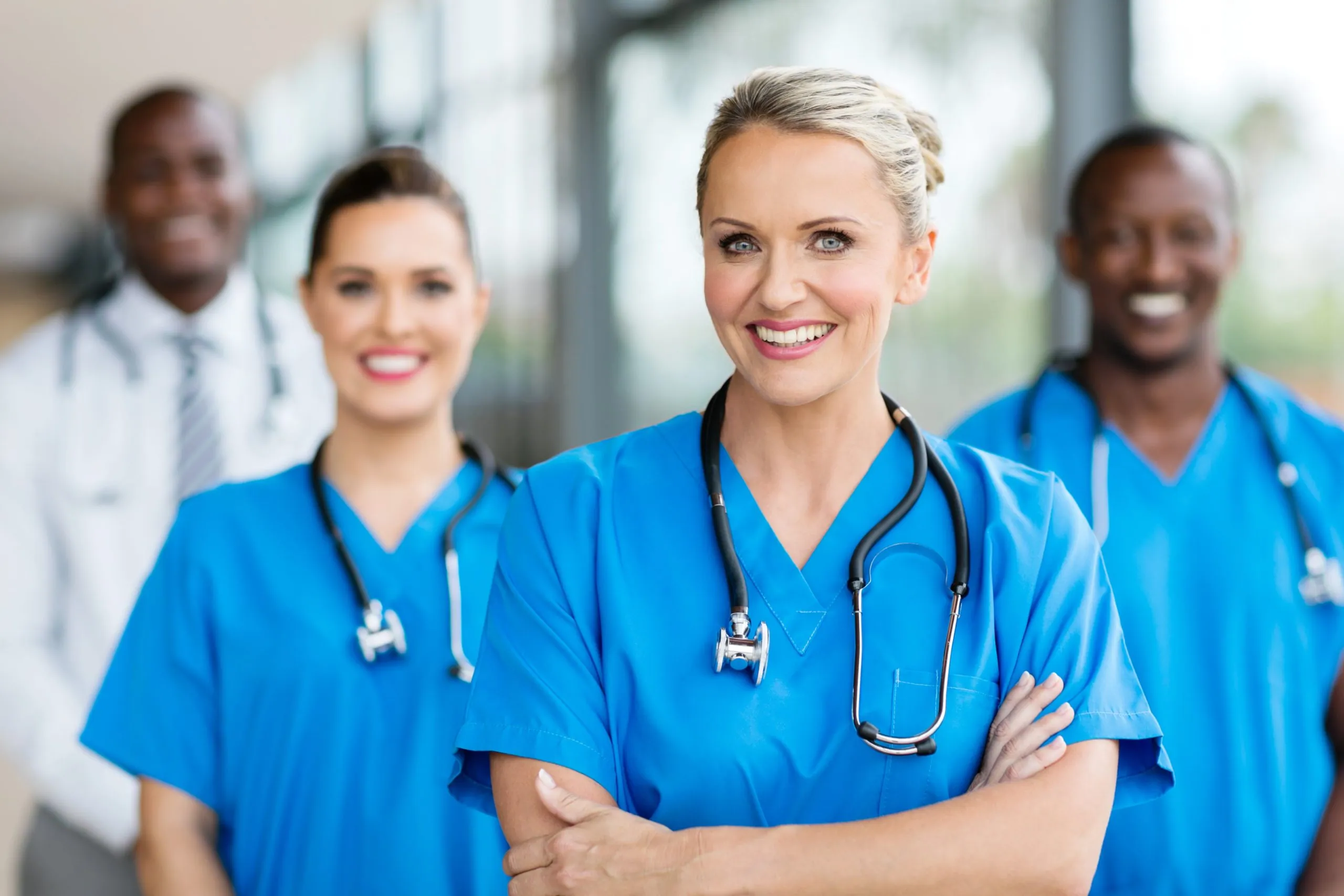 Medical nurses with colleagues at the back.